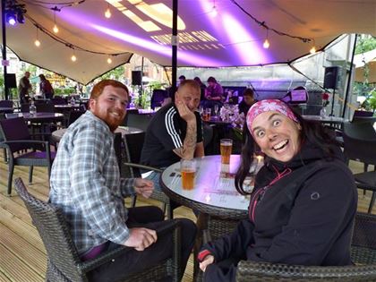 Having beer with her rescuers Alan and Andy, who advised her how to find accommodation in Edinburgh, which was overcrowded due to the ongoing music festival.