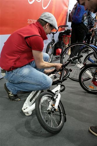 Vácalv Liška showing a folding scooter 