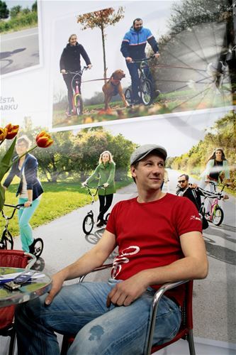 Scooter Ambassador and the actor Václav Liška surrounded by scooters.