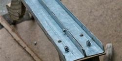 The hybrid steel footboard made from the banister of our house.