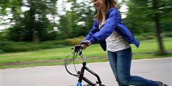 Petra Kobližková is trying an electro-scooter.
