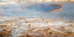 The Strokkur bubbling geyser which erupts every few minutes throwing a column of water to a height of approximately 20-30 m.
