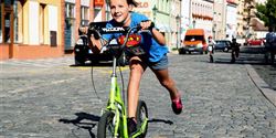 A girl on the Yedoo Wzoom scooter was in the lead on the route of the racing circuits for older children.