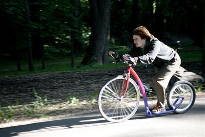 Kuba from the “Nudle s mákem” team on his rainbow scooter.